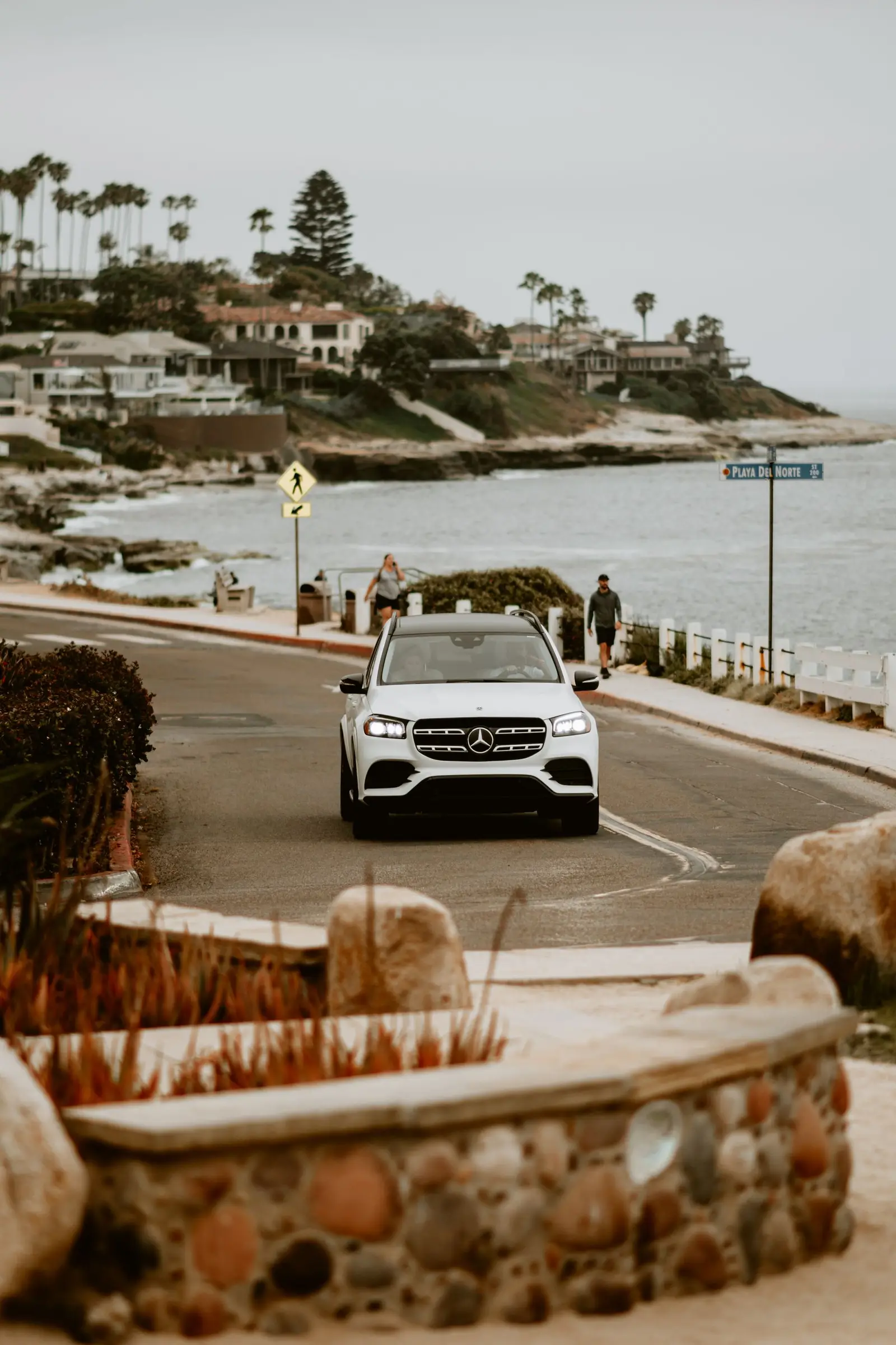 SUV driving along a coastal road