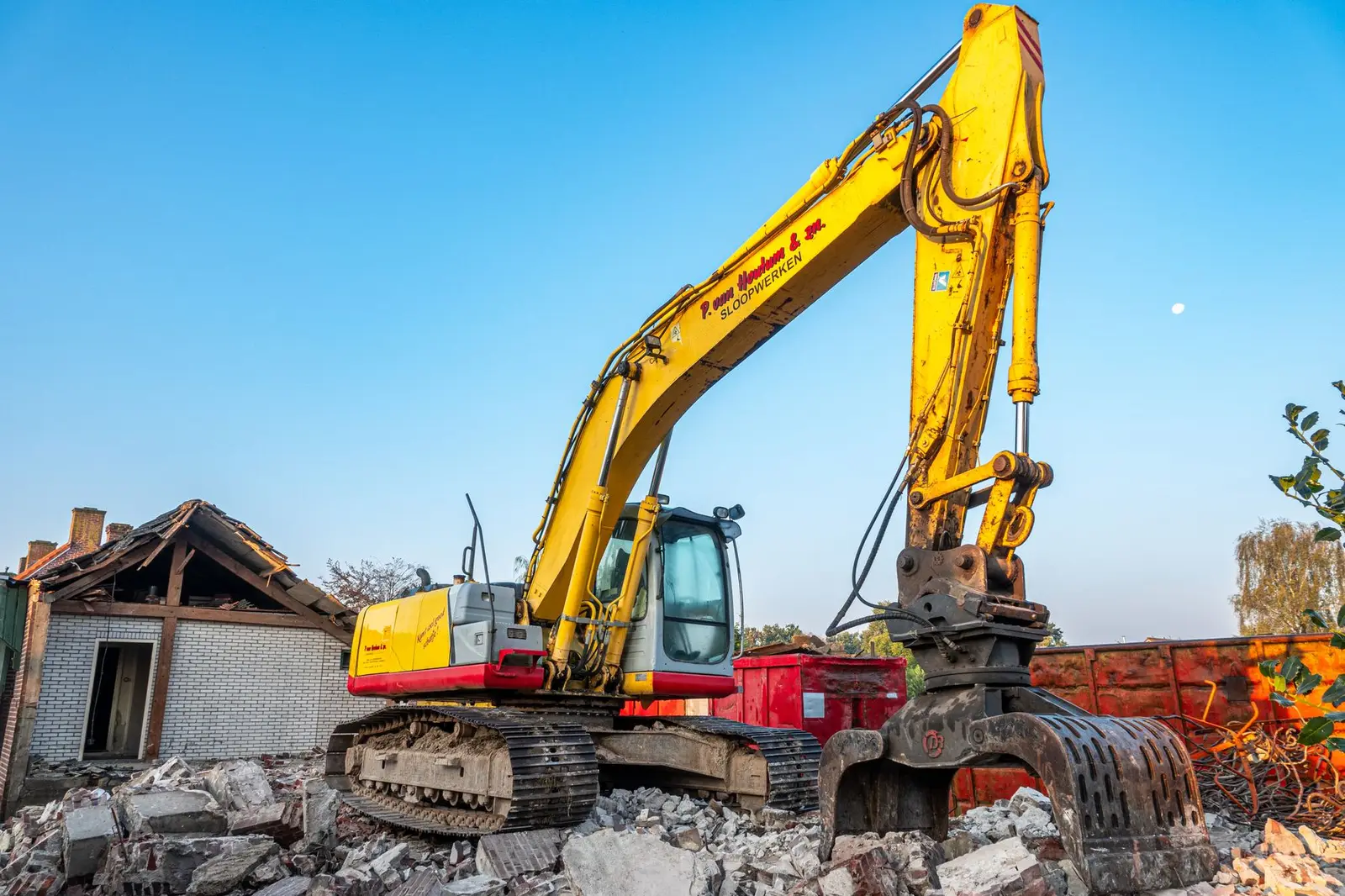Excavator demolishing a building