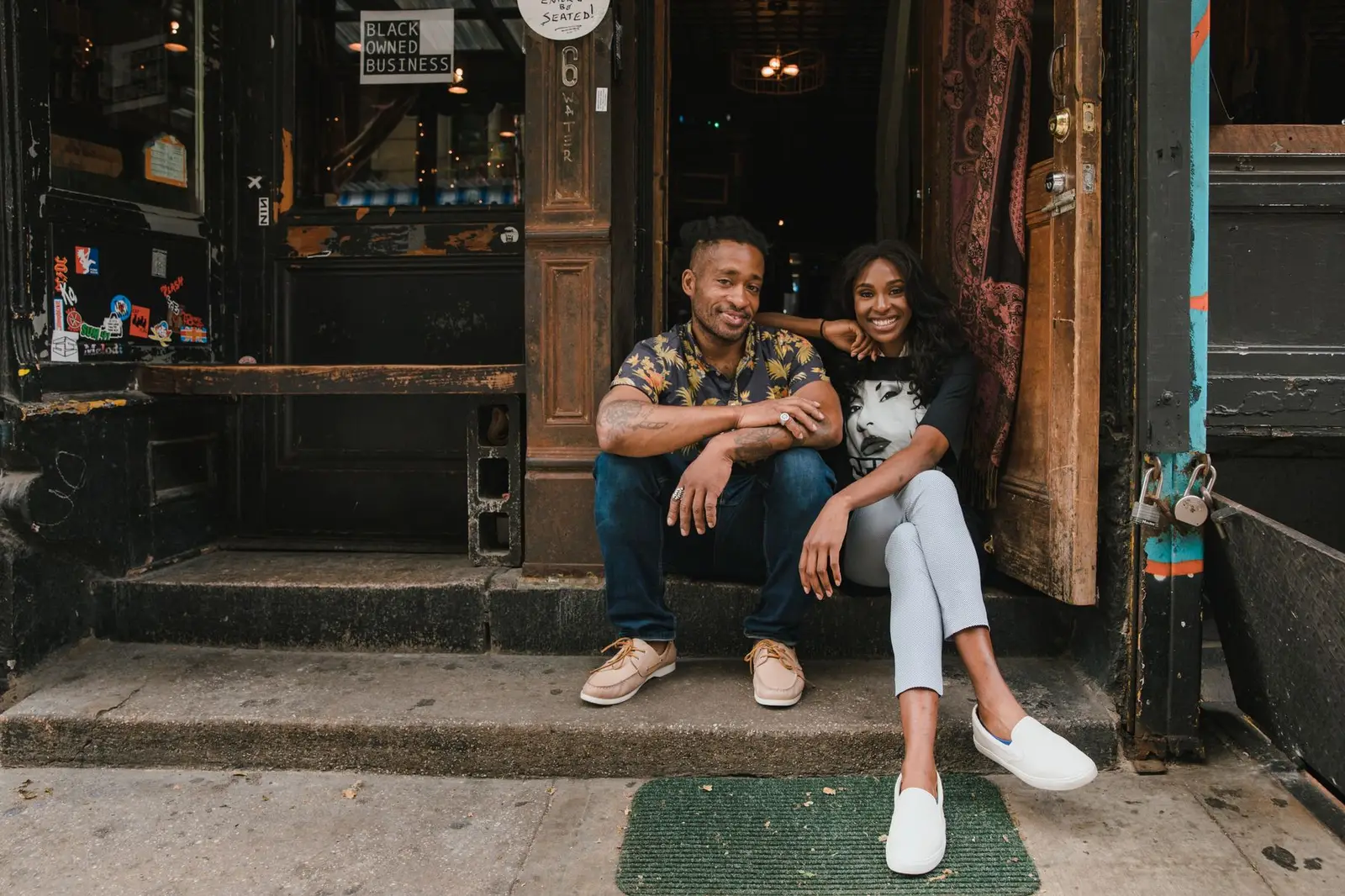Business owners in front of their shop